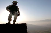 As the sun rises, Sgt. Phillip Chang, from the Alaska Army National Guard, patrols the outskirts of Kabul, Afghanistan. This photo appeared on www.army.mil. October 4, 2005 (by Sgt. Benjamin T. Donde)