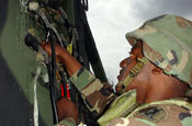 Sgt. 1st Class Lemmon Pitts, Delaware Army National Guard's 280th Signal Battalion, checks connections in the signal entrance panel at Fort Meade during the Grecian Firebolt exercise. June 24, 2005 (by SFC Jo Hoots)