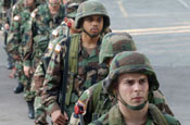 71st Brigade Combat Team Soldiers of the Texas Army National Guard move into the reception, staging andoOnward integration briefing room after arriving in Romania to participate in ROMEX 05. July 18, 2005 (by Courtesy of 1st Armored Division)