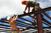 The North Dakota Army National Guard 142nd Engineer Battalion and their counterparts from the Armed Forces of the Philippines Navy Seabees and Air Force Engineers continue construction at the San Buenaventura School Project site at Luisiana, Laguna on February 21, 2005 during Balikatan 2005. Balikatan is a yearly excercise to improve humanitarian assistance, warfight relief and to promote interoperability between the Armed Forces of the Philippines and United States military. (US Air Force photo by SrA Francisco V. Govea II)