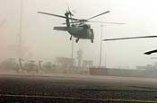 A UH-60 Blackhawk helicopter belonging to the Colorado National Guard 2nd Battalion, 135th General Support Aviation Regiment, takes off from Al Shuaiba Port near Camp Arifjan, Kuwait. The helicopters were re-assembled with specific theater modifications once removed from the ship and then flown to Northern Kuwait for further training. (Army photo by Staff Sgt. Lorin T. Smith)